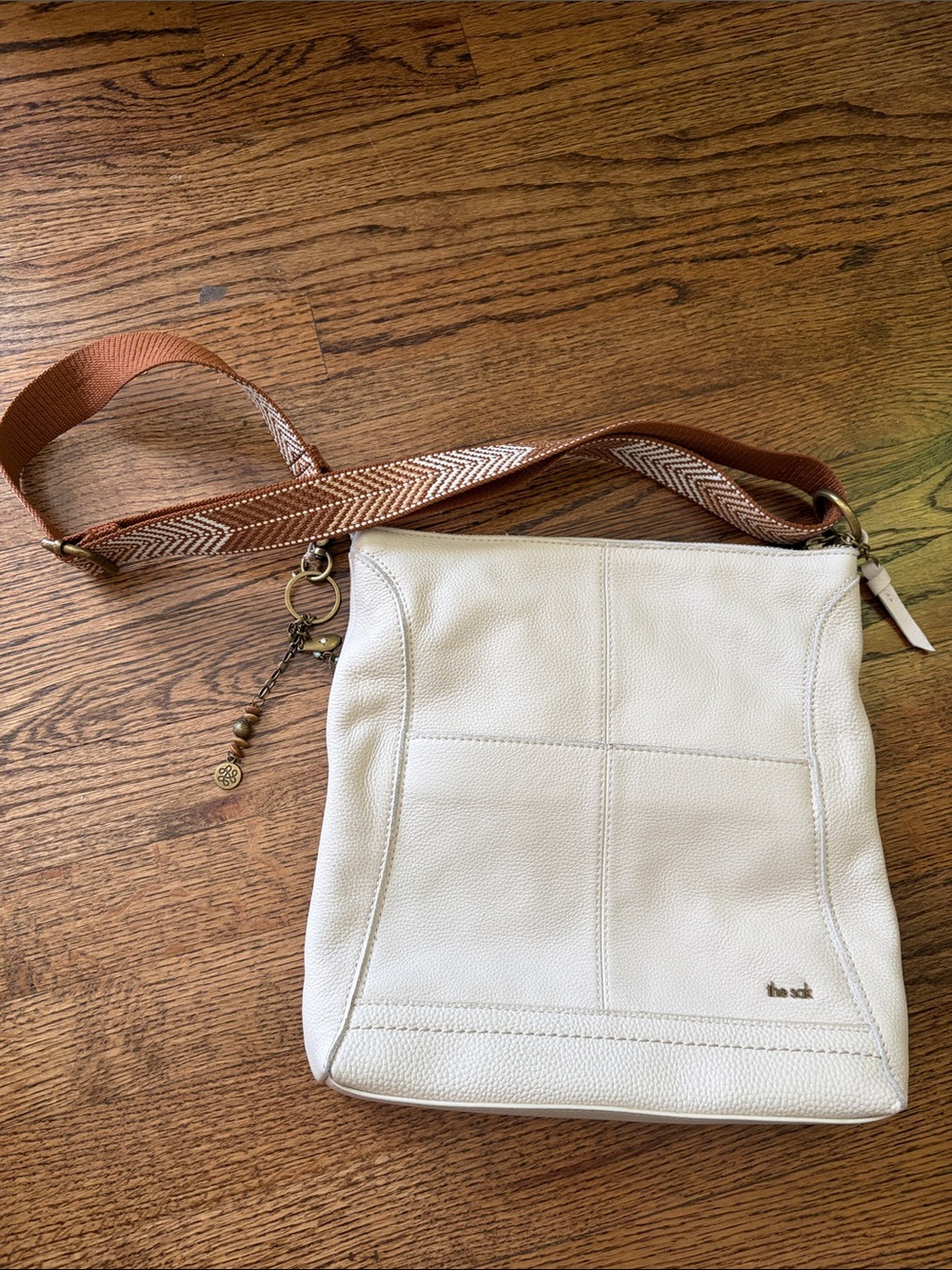 The Sak Ivory Crossbody Bag with Brown Strap